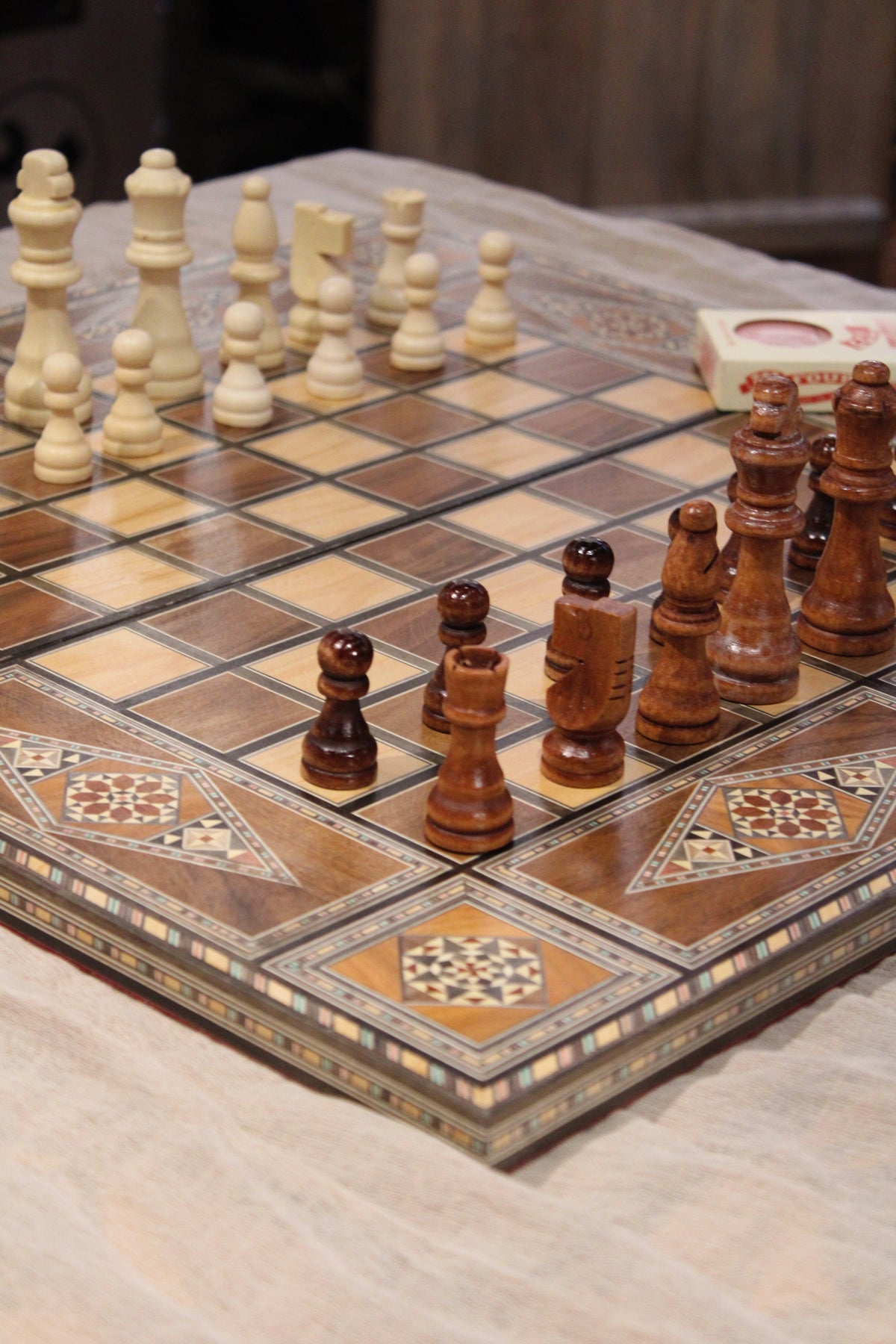 Close up of the foldable chess board with the wooden black and white wooden chess pieces-you can find it at  Soumak Boutique , Kids Market on Granville Island