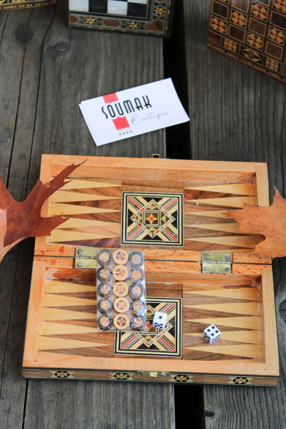 Backgammon side of the Mini Syrian Board, complete with wooden checkers and dice, showcasing its stylish floral design.