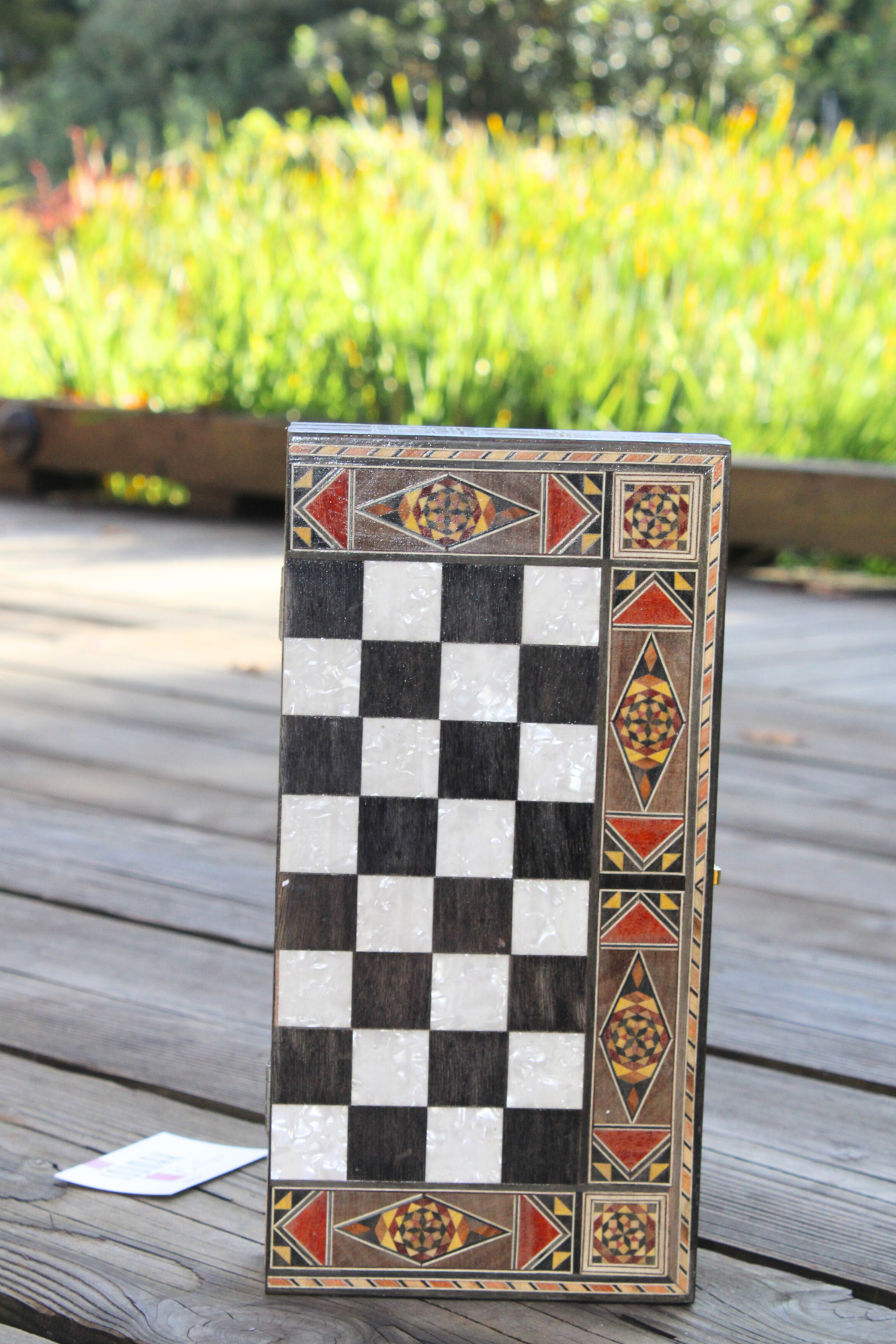 Vertically closed view of the Classic Elegance Chess and Backgammon Board, emphasizing its striking black and white square design. This sophisticated piece combines functionality with timeless style, making it a perfect addition to your home decor. Available at Soumak Boutique.