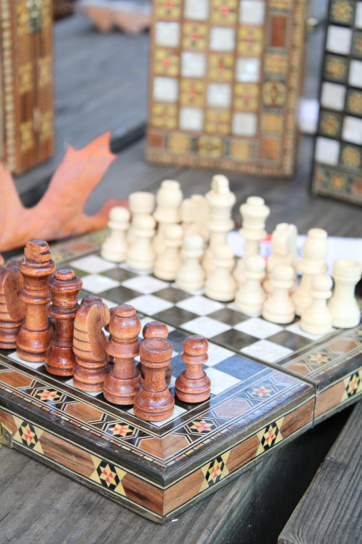 Close-up view of the intricately carved wooden chess pieces on the Mini Syrian Board, highlighting the craftsmanship and attention to detail.