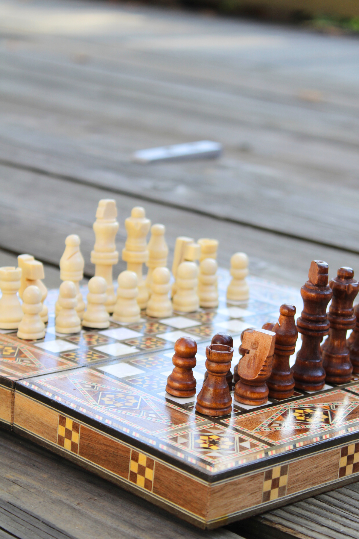 Close-up corner view of the Golden Blossom Mosaic Chess and Backgammon Board, highlighting the stunning yellow floral designs and the rich textures of the mosaic inlaid wood and mother of pearl. A perfect blend of artistry and functionality, ideal for both play and display.