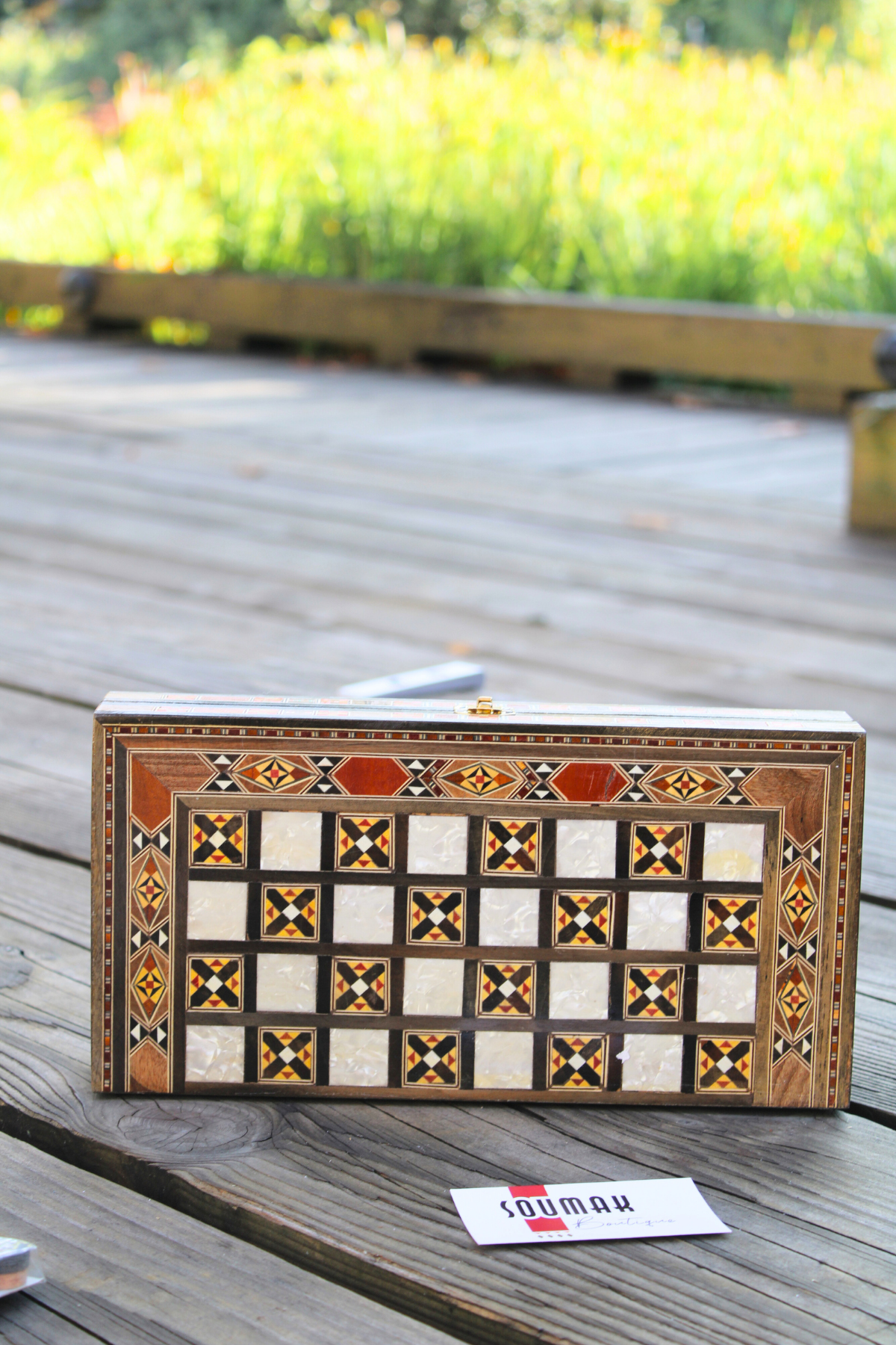 Horizontally closed view of the handcrafted Radiant Mosaic Chess and Backgammon Board, highlighting its elegant design and premium materials, including rosewood, oak, and mother of pearl inlay.