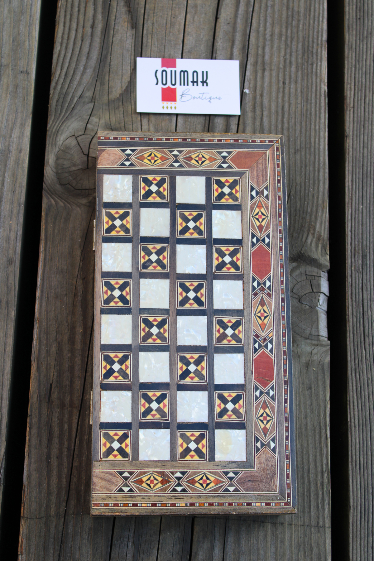 Closed view of the handcrafted Radiant Mosaic Chess and Backgammon Board, showcasing its elegant design and rich materials, including rosewood, oak, and mother of pearl inlay.