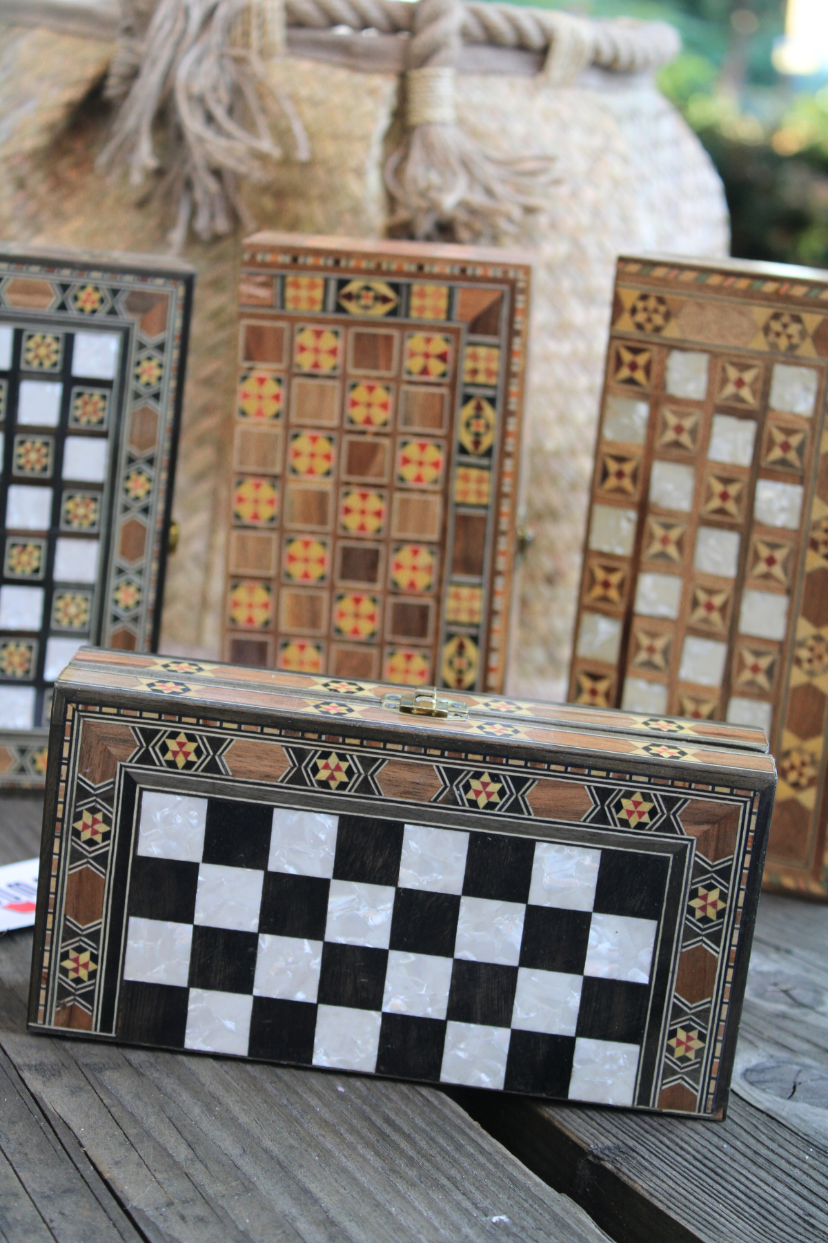 Horizontal view of the Mini Syrian Handcrafted Chess and Backgammon Board, showcasing its elegant black and white design, perfect for travel.