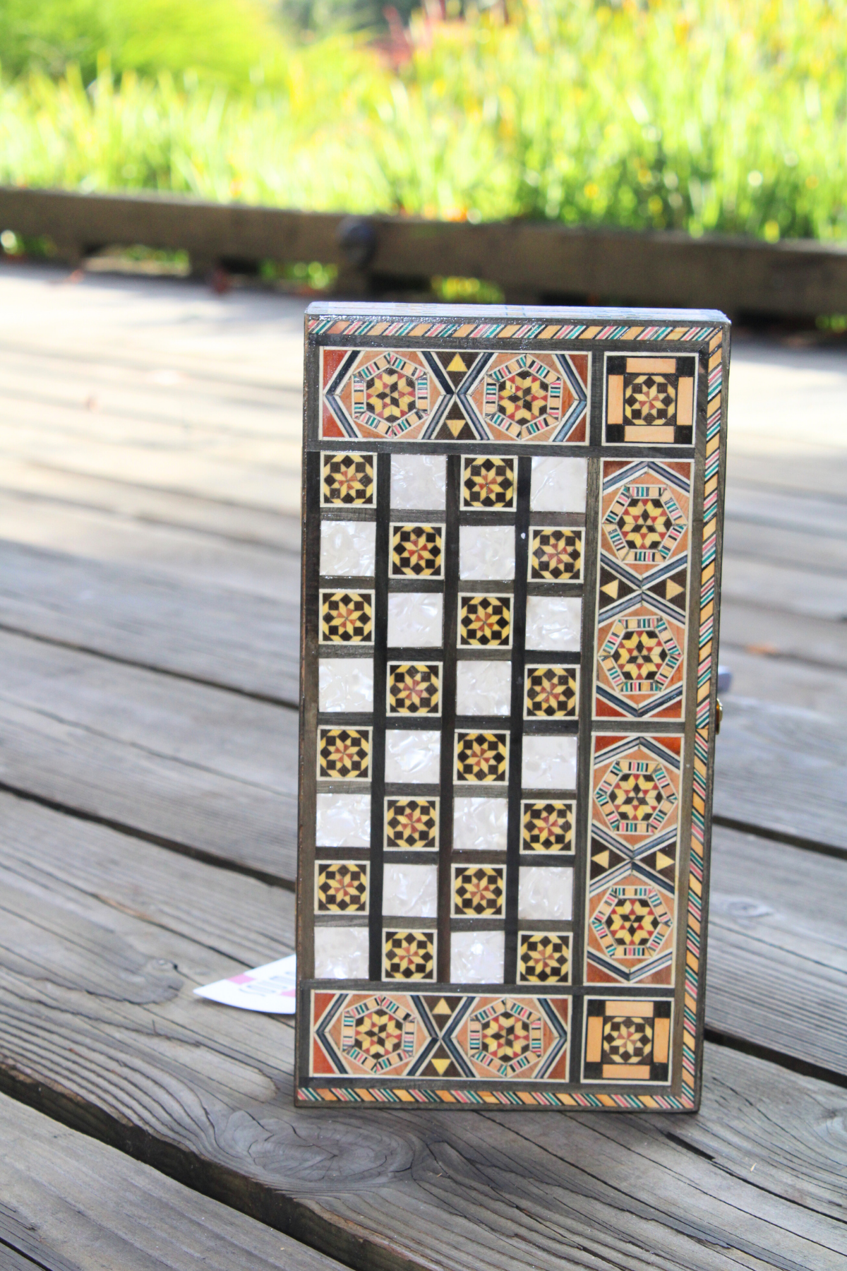 Vertically closed view of the Sunlit Blossom Mosaic Chess and Backgammon Board, highlighting its captivating floral design. This exquisite piece combines functionality with artistry, making it a delightful addition to your home decor. Available at Soumak Boutique.