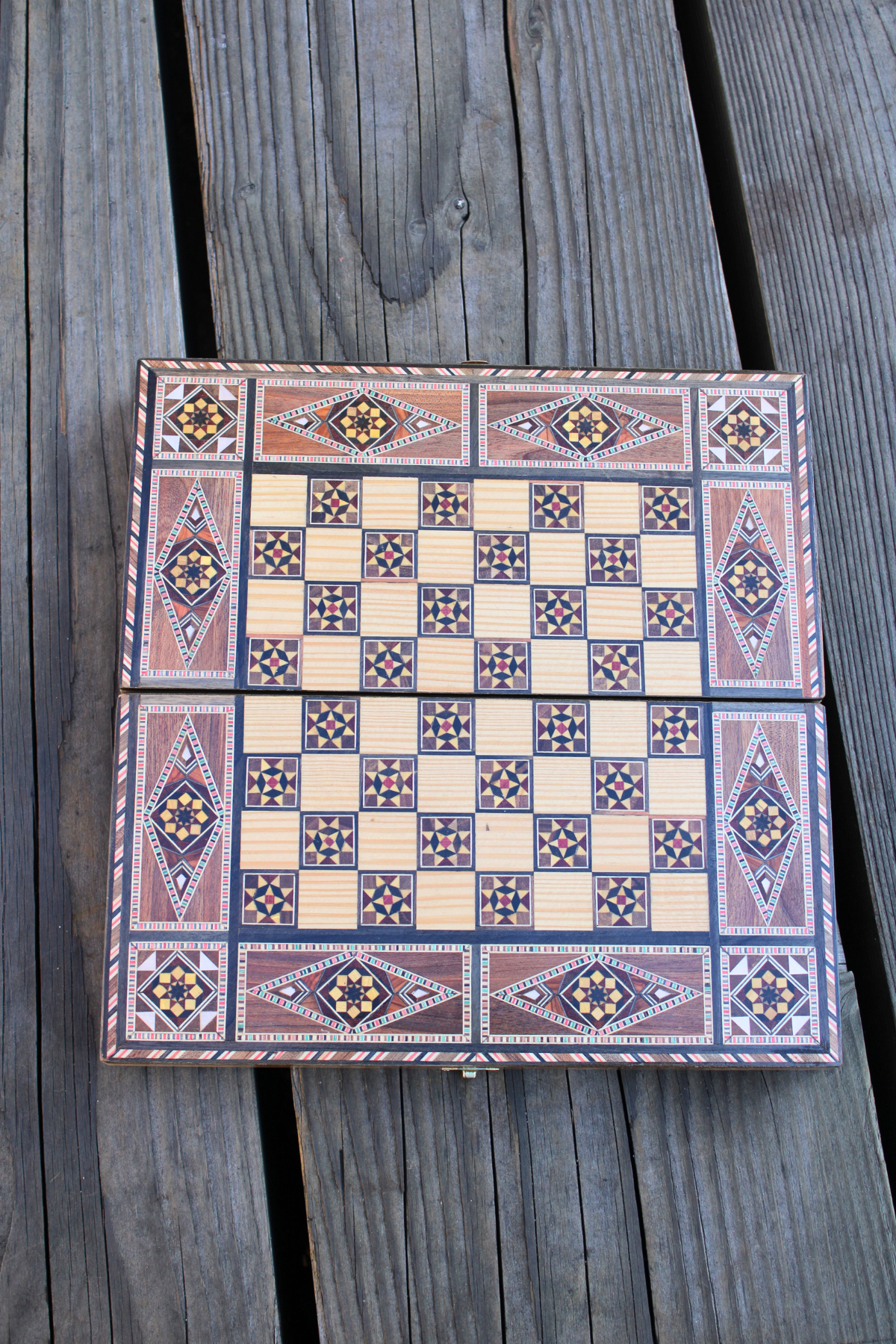 Open view of the chess side of the Woodland Mosaic Chess and Backgammon Board, highlighting its exquisite wooden mosaic craftsmanship. This elegant board invites strategic play while showcasing the beauty of natural materials in a timeless design.